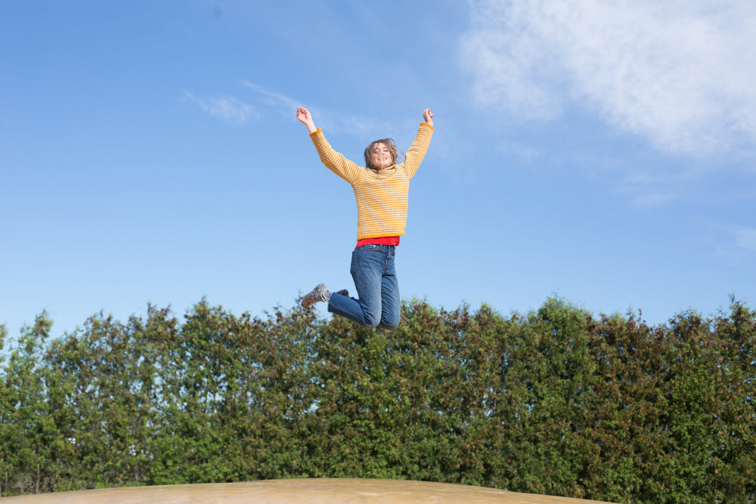 Happy learner driver celebrating after passing her driving test successfully
