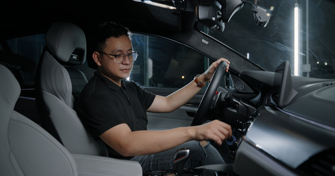 a man driving a car